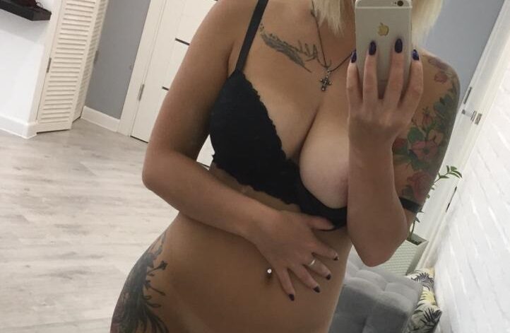 woman taking selfie in sexy black lingerie