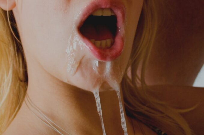 cum dripping out from a mouth