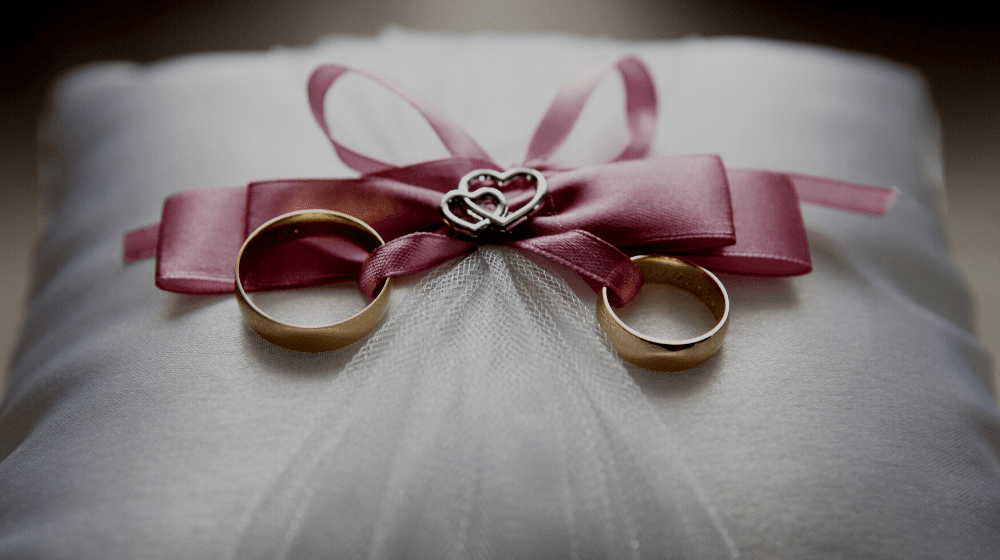 wedding rings on pillow